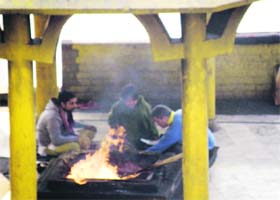Devotees perform hawan at the Baglamukhi temple in Kangra district