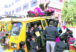 The police inspects school vehicles near Pratap Public School and Dyal Singh School to check overloading in Karnal on Tuesday. 