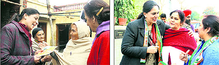 Barinderpreet Kaur, wife of SAD candidate Pargat Singh, and (right) Ravneet Kaur, wife of Congress nominee Jagbir Singh Brar, interact with voters in Jalandhar on Tuesday