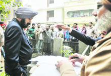 Members of the trust protest against the government move in Ludhiana on Tuesday. 