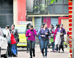 Girls wearing woollens save themselves from the biting cold in Ludhiana on Tuesday.