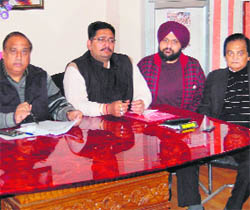 President of the Punjab Chemist Association Surinder Duggal (left) adresses mediapersons in Amritsar on Wednesday. 