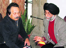 Conservationist Bill Kataky from Britain (left)  and Balvinder Singh (right) discuss restoration of the Golden Temple in Amritsar on Wednesday. 