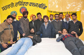 Volunteers donating blood at the blood donation camp organised in the college in Bathinda on Wednesday