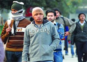Delhiites wrap themselves in layers of woollens on Wednesday