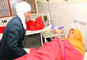 Shanti (50) being treated in the Civil Hospital after she got buried as earth caved in at Munak village in Karnal on Wednesday