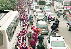 Children walk a long distance up to the stadium