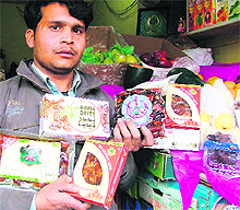 A salesman in a Ludhiana market shows Dates from the United Arab Emirates that have become a hit with city residents