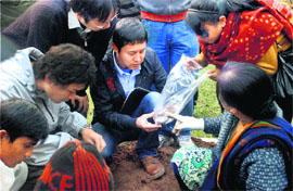 Japanese officials collect the remains of Japanese soldiers of the World War-II after exhuming them from the War Cemetery in Guwahati on Wednesday. 