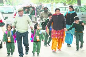 Parents pick up their wards from a school in Panchkula following a strike by school bus operators on Thursday