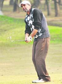 IPS Mann plays a shot during the CNEB All-India Amateur Golf Tournament at the Golf Club, Chandigarh, on Thursday