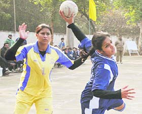 Players of Punjabi University, Patiala, and Delhi University in action during the North Zone Inter-University Womens Handball Tournament at the Postgraduate Government College, Sector 11, Chandigarh, on Thursday