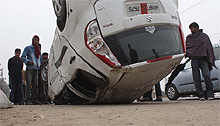 A car turned turtle in a road mishap at Sector 39 near NH-8 in Gurgaon on Thursday
