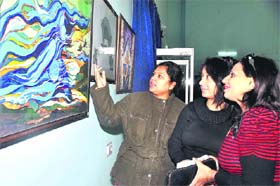 Art lovers view creations of national acclaimed artist at the 5th All-India Contemporary Art Exhibition at DPS in Haridwar on Thursday