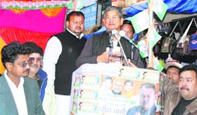 Union Minister of State for Agriculture, Food Processing and Parliamentary Affairs and senior Congress leader Harish Rawat addresses an election meeting at Didihat in Pithoragarh district on Thursday