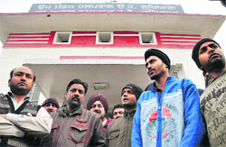 Relatives and colleagues of Paramjit Singh gathered outside the railway hospital in Ludhiana on Thursday. 