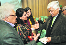 Lord Meghnad Desai (L), Kishwar Desai with Sanjay Baru (R), former Media Adviser to PM, at the function in New Delhi on Thursday. 