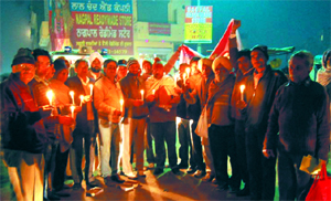 Members of the NGOs of Bhucho Mandi and Bathinda come together to organise a candle light march as part of the voter awareness campaign in Bhucho Mandi on Thursday. 