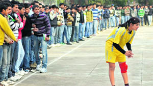 Boys stand close to the touchline during a handball match for women at Postgraduate Government College, Sector 11, Chandigarh, on Friday.