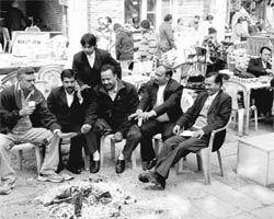 Advocates sit around a bonfire at the District Courts in Sector 17, Chandigarh, on Friday. 