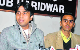 Team Anna member Kumar Vishwas (left) talks about their campaign in Haridwar on Friday. 