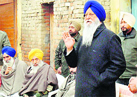 RS Brahmpura addresses a meeting at Sheikhchack village in Khadur Sahib.