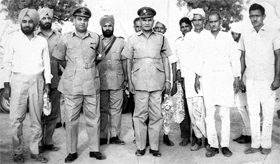 S. N. Mathur (second from left, with his hands at the back) poses with a group of officers.