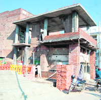 Construction work on to expand a private clinic in New Tehsilpura area in Amritsar.
