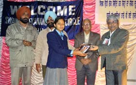 A student being felicitated during the National Youth Day celebrations organised by the Swami Vivekanand Study Circle to mark the birth anniversary of Swami Vivekanand in Bathinda on Saturday