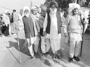 Villagers on their way to vote during panchayat samiti elections at Khuda Ali Sher in Chandigarh on Saturday. 