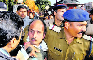 A man who threw a shoe at Team Anna in police custody in Dehradun on Saturday.