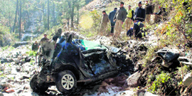 Police personnel at the accident site near Tutikandi in Shimla on Friday night.