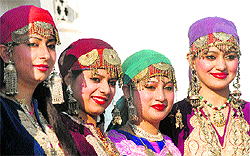 Artistes from Jammu and Kashmir attired in their traditional dress in New Delhi on Saturday. They will take part in the Republic Day Parade as part of the state tableau