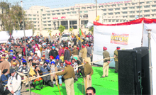 The SAD-BJP combine organises a rally a few yards from PIMS in Jalandhar on Saturday. Residents being stopped from commuting on Garha road. 