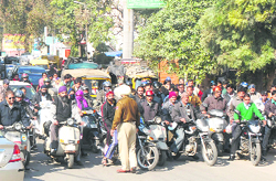Residents being stopped from commuting on Garha road. 
