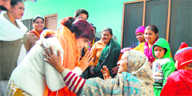 Monica Joshi, wife of sitting BJP MLA Anil Joshi, meets voters in her husbands constituency.