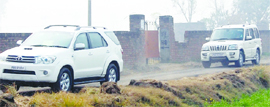 Fuel-guzzling SUVs of a candidate head for a campaign site in Amritsar.