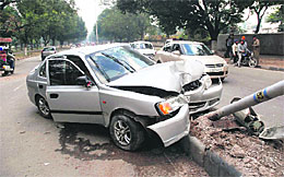 The car that rammed into a streetlight pole on the road separating Sectors 21 and 18 