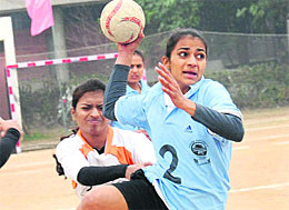 Players in action during the All-India University Handball Championship at Panjab University, Chandigarh, on Sunday. Tribune photo: Pradeep Tewari