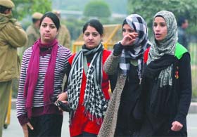 Warmly clad girls at Connaught Place on a cold Sunday in New Delhi
