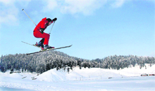 A skiing professional makes the most of the snow on the slopes of Gulmarg in the Kashmir valley. 