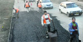 The stretch between Rama Mandi and PAP Chowk being re-carpeted in Jalandhar on Sunday.