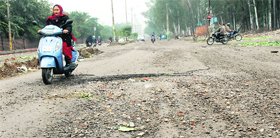 Potholes and debris in the Ladowali-Guru Nanak Pura link road creates problem for commuters. Problem aggravates during night in absence of proper lights.