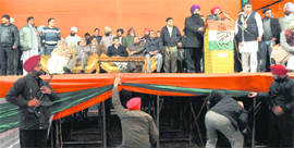 Policemen check the stage minutes before the arrival of Congress leader Capt Amarinder Singh at Gyaspura in Ludhiana on Friday.