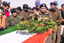 Jharkhand DGP GS Rath pays tributes to the policemen killed in Saturdays landmine blast in a jungle of Garhwa district of Jharkhand, on Sunday. 
