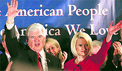 Republican Presidential candidate and former House Speaker Newt Gingrich waves to the crowd with his wife Callista during a primary night rally in Columbia