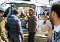 Security personnel check Sukhbir Badal's helicopter at Samalsar in Moga on Monday.
