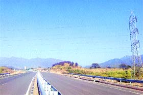 High-tension lines passing over the newly built Pinjore-Parwanoo bypass