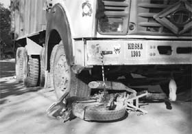 A truck drags a bike in an accident on the Mubarikpur-Dera Bassi link road