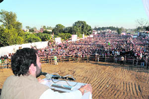 Congress general secretary Rahul Gandhi addresses an election rally in Dehradun on Monday.